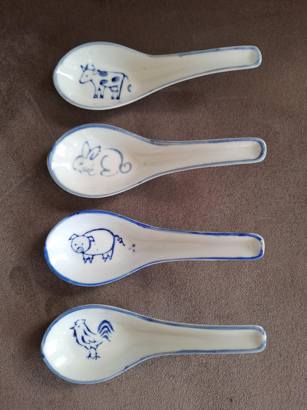 Set van 4 Porseleinen vintage lepels, decor van dieren